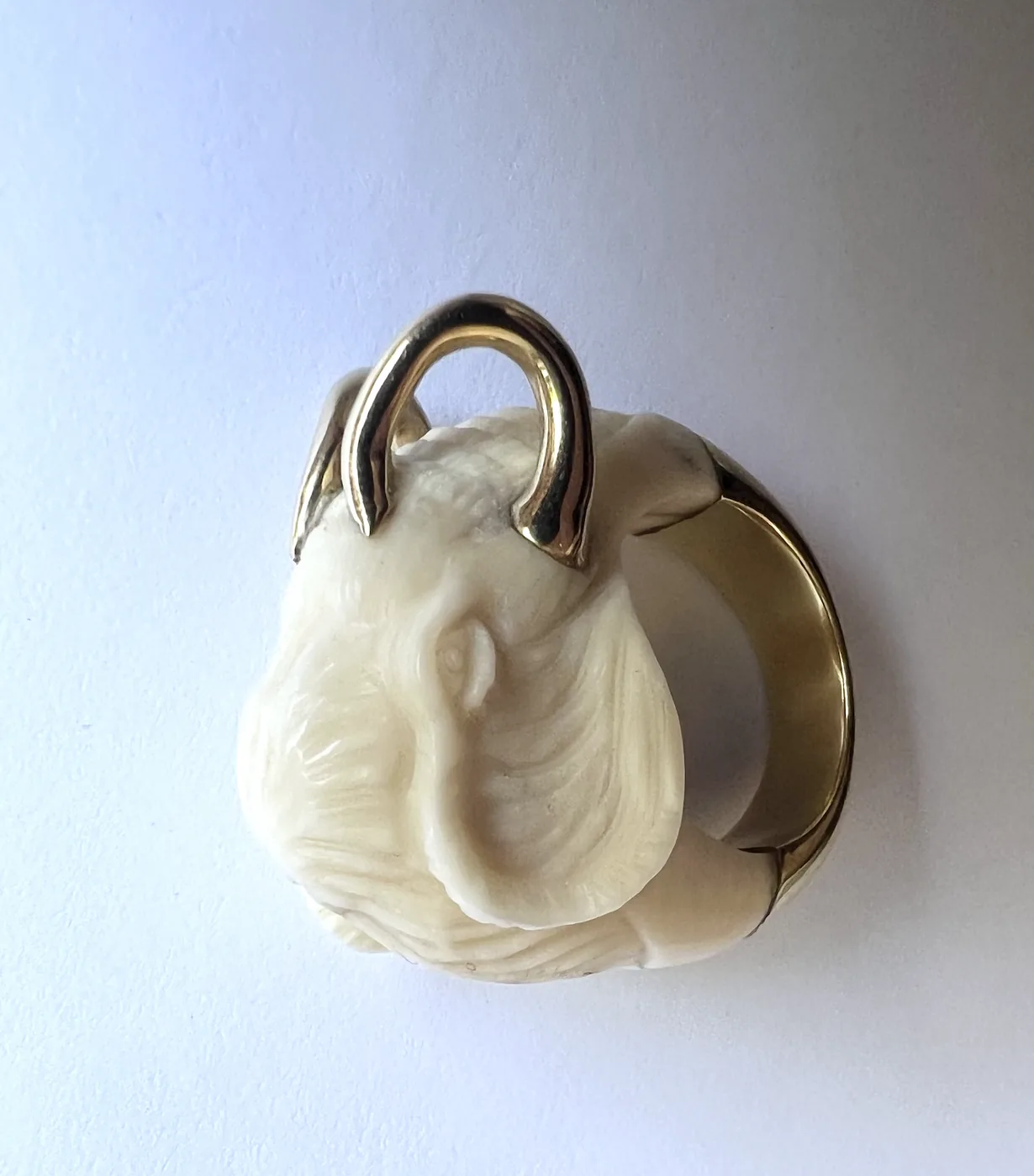 Paris Reid reference photo: carved elephant head ring in gold
